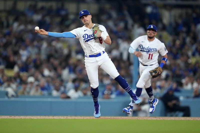 Sep 22, 2023; Los Angeles, California, USA; Los Angeles Dodgers shortstop Enrique Hernandez aka Kike Hernandez (8) throws to first base against the San Francisco Giants at Dodger Stadium. Mandatory Credit: Kirby Lee-USA TODAY Sports