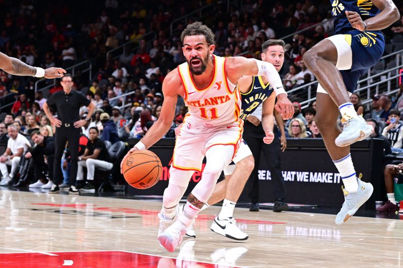 ATLANTA, GA - OCTOBER 8: Trae Young #11 of the Atlanta Hawks dribbles the ball during the game against the Indiana Pacers during a NBA preseason game on October 8, 2024 at State Farm Arena in Atlanta, Georgia.  NOTE TO USER: User expressly acknowledges and agrees that, by downloading and/or using this Photograph, user is consenting to the terms and conditions of the Getty Images License Agreement. Mandatory Copyright Notice: Copyright 2024 NBAE (Photo by Adam Hagy/NBAE via Getty Images)