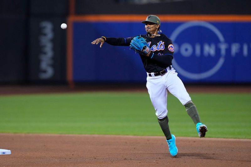 May 21, 2023; New York City, New York, USA; New York Mets shortstop Francisco Lindor (12) throws out Cleveland Guardians center fielder Myles Straw (7) (not pictured) after fielding a ground ball during the eighth inning at Citi Field. Mandatory Credit: Gregory Fisher-USA TODAY Sports