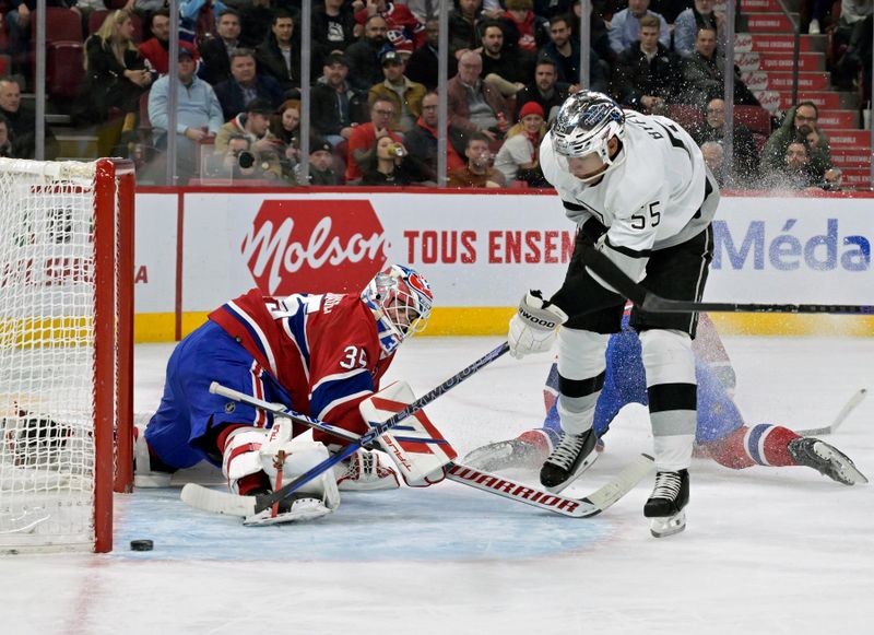 Dec 7, 2023; Montreal, Quebec, CAN; Los Angeles Kings forward Quinton Byfield (55) scores a goal against Montreal Canadiens goalie Sam Montembeault (35) during the first period at the Bell Centre. Mandatory Credit: Eric Bolte-USA TODAY Sports
