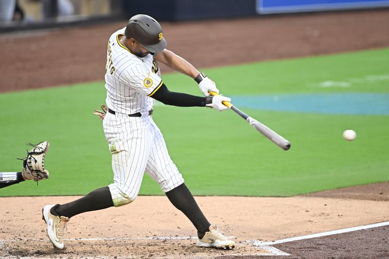 May 26, 2025; San Diego, California, USA; San Diego Padres shortstop Xander Bogaerts (2) hits a single during the fourth inning against the Miami Marlins at Petco Park. Mandatory Credit: Denis Poroy-Imagn Images