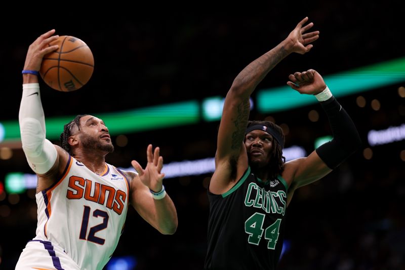 BOSTON, MASSACHUSETTS - FEBRUARY 03: Ish Wainright #12 of the Phoenix Suns takes a shot against Robert Williams III #44 of the Boston Celtics  at TD Garden on February 03, 2023 in Boston, Massachusetts. NOTE TO USER: User expressly acknowledges and agrees that, by downloading and or using this photograph, User is consenting to the terms and conditions of the Getty Images License Agreement. (Photo by Maddie Meyer/Getty Images)