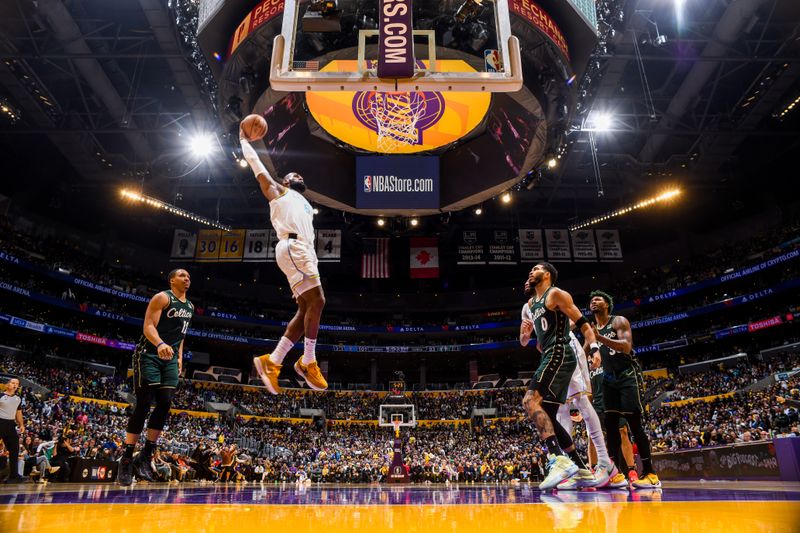 LOS ANGELES, CA - DECEMBER 13: LeBron James #6 of the Los Angeles Lakers dunks the ball during the game against the Boston Celtics on December 13, 2022 at Crypto.Com Arena in Los Angeles, California. NOTE TO USER: User expressly acknowledges and agrees that, by downloading and/or using this Photograph, user is consenting to the terms and conditions of the Getty Images License Agreement. Mandatory Copyright Notice: Copyright 2022 NBAE (Photo by Andrew D. Bernstein/NBAE via Getty Images)