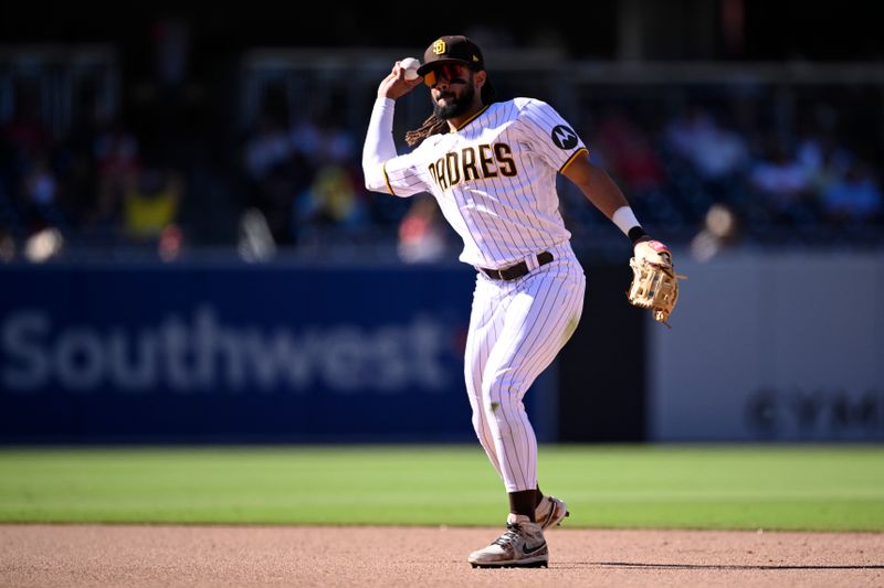 Sep 6, 2023; San Diego, California, USA; San Diego Padres second baseman Fernando Tatis Jr. (23) throws to first base during the ninth inning against the Philadelphia Phillies at Petco Park. Mandatory Credit: Orlando Ramirez-USA TODAY Sports