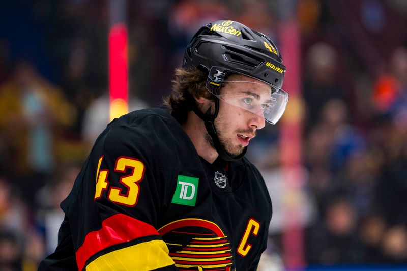 Nov 9, 2024; Vancouver, British Columbia, CAN; Vancouver Canucks defenseman Quinn Hughes (43) skates during warm up prior to a game against the Edmonton Oilers at Rogers Arena. Mandatory Credit: Bob Frid-Imagn Images