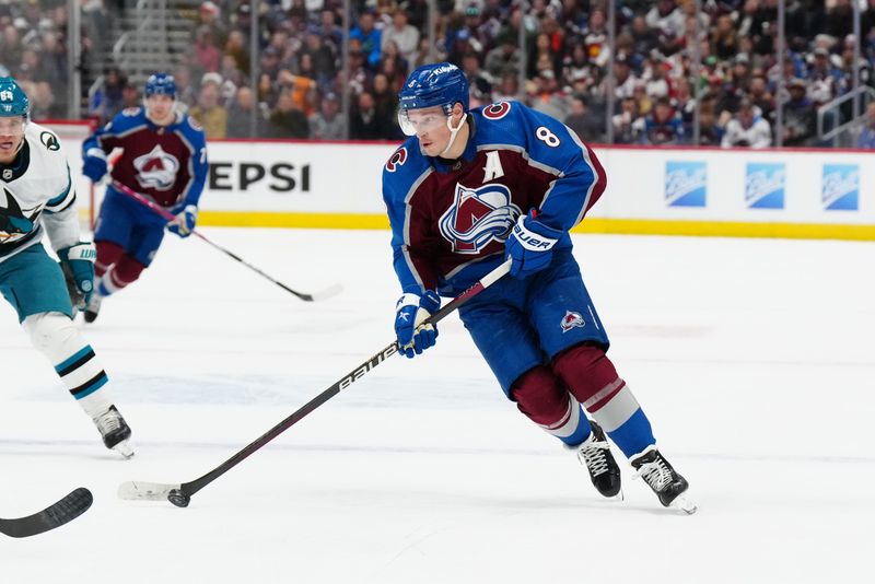 Dec 31, 2023; Denver, Colorado, USA; Colorado Avalanche defenseman Cale Makar (8) controls the puck in the second period against the San Jose Sharks at Ball Arena. Mandatory Credit: Ron Chenoy-USA TODAY Sports