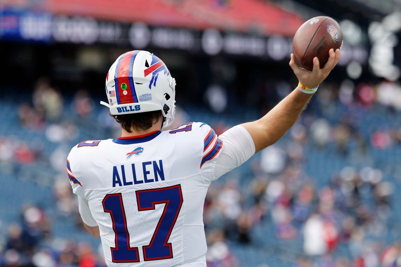 Buffalo Bills quarterback Josh Allen (17) makes a warm-up pass before an NFL football game against the New England Patriots on Sunday, Oct. 22, 2023, in Foxborough, Mass. (AP Photo/Greg M. Cooper)