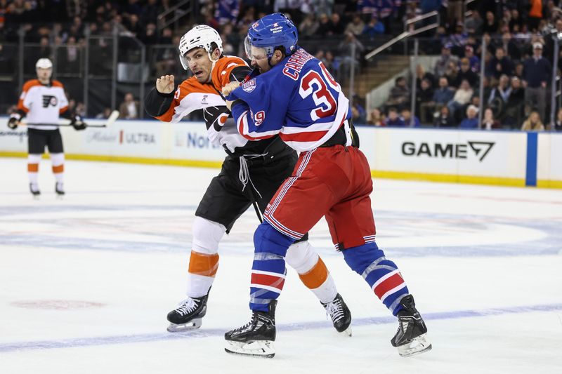 Feb 26, 2026; New York, New York, USA;  New York Rangers center Sam Carrick (39) and Philadelphia Flyers right wing Garnet Hathaway (19) fight in the first period at Madison Square Garden. Mandatory Credit: Wendell Cruz-Imagn Images