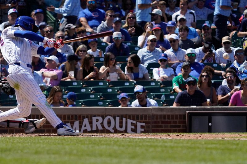 Aug 7, 2024; Chicago, Illinois, USA; Chicago Cubs outfielder Pete Crow-Armstrong (52) hits a single against the Minnesota Twins during the third inning at Wrigley Field. Mandatory Credit: David Banks-USA TODAY Sports