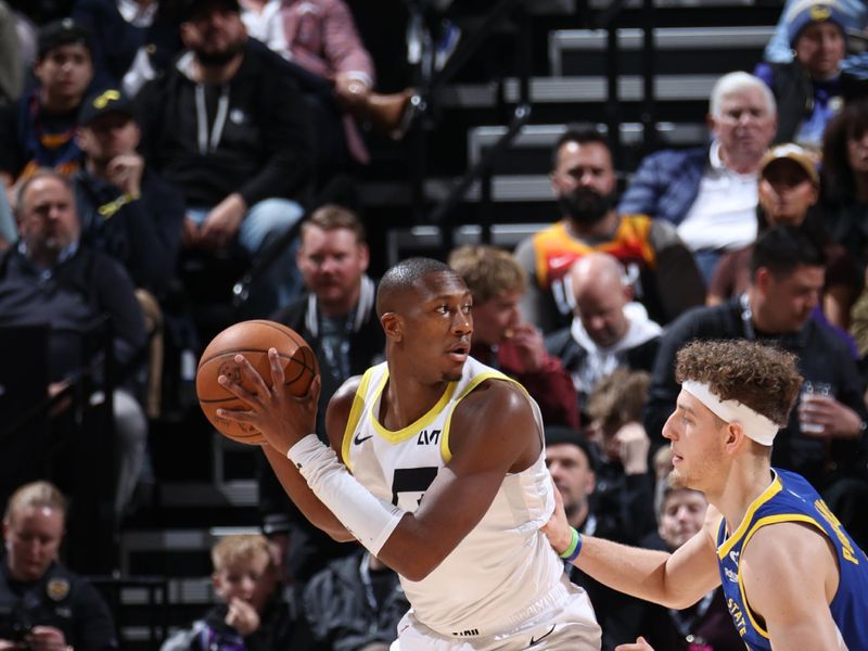 SALT LAKE CITY, UT - FEBRUARY 15: Kris Dunn #11 of the Utah Jazz handles the ball during the game against the Golden State Warriors on February 15, 2024 at Delta Center in Salt Lake City, Utah. NOTE TO USER: User expressly acknowledges and agrees that, by downloading and or using this Photograph, User is consenting to the terms and conditions of the Getty Images License Agreement. Mandatory Copyright Notice: Copyright 2024 NBAE (Photo by Melissa Majchrzak/NBAE via Getty Images)