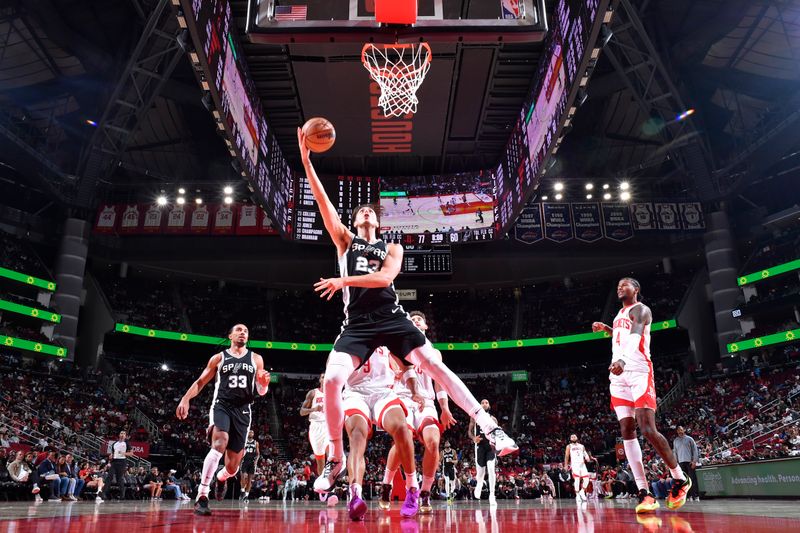 HOUSTON, TX - OCTOBER 17: Zach Collins #23 of the San Antonio Spurs drives to the basket during the game against the Houston Rockets on October 17, 2024 at the Toyota Center in Houston, Texas. NOTE TO USER: User expressly acknowledges and agrees that, by downloading and or using this photograph, User is consenting to the terms and conditions of the Getty Images License Agreement. Mandatory Copyright Notice: Copyright 2024 NBAE (Photo by Logan Riely/NBAE via Getty Images)