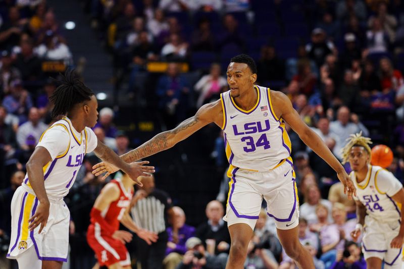 Feb 4, 2023; Baton Rouge, Louisiana, USA; LSU Tigers forward Shawn Phillips (34) and guard Cam Hayes (1) react after a play against the Alabama Crimson Tide during the second half at Pete Maravich Assembly Center. Mandatory Credit: Andrew Wevers-USA TODAY Sports