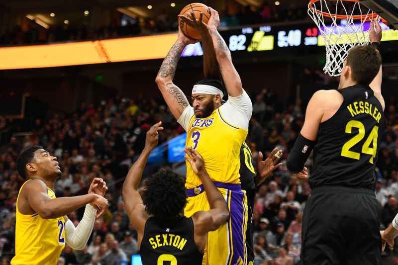 SALT LAKE CITY, UTAH - FEBRUARY 14: Anthony Davis #3 of the Los Angeles Lakers rebounds over Collin Sexton #2 of the Utah Jazz during the second half of a game at Delta Center on February 14, 2024 in Salt Lake City, Utah. NOTE TO USER: User expressly acknowledges and agrees that, by downloading and or using this photograph, User is consenting to the terms and conditions of the Getty Images License Agreement. (Photo by Alex Goodlett/Getty Images)