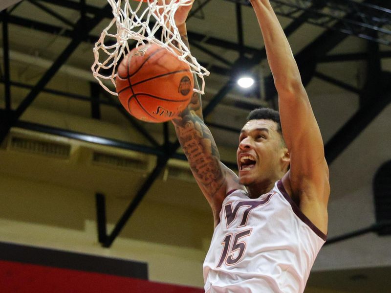 Nov 23, 2023; Kissimmee, FL, USA;  Virginia Tech Hokies center Lynn Kidd (15) dunks the ball against the Boise State Broncos in the second half during the ESPN Events Invitational at State Farm Field House. Mandatory Credit: Nathan Ray Seebeck-USA TODAY Sports