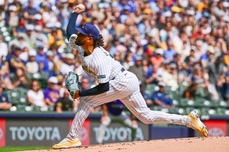 Sep 8, 2024; Milwaukee, Wisconsin, USA; Milwaukee Brewers starting pitcher Freddy Peralta (51) pitches in the first inning against the Colorado Rockies at American Family Field. Mandatory Credit: Benny Sieu-Imagn Images