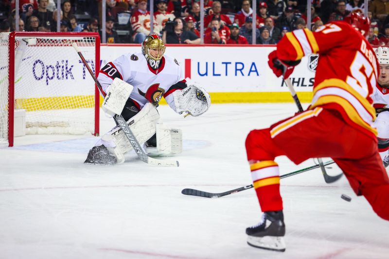 Jan 9, 2024; Calgary, Alberta, CAN; Ottawa Senators goaltender Joonas Korpisalo (70) makes a save against Calgary Flames defenseman Nick DeSimone (57) during the second period at Scotiabank Saddledome. Mandatory Credit: Sergei Belski-USA TODAY Sports