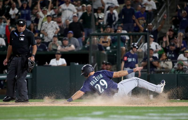 May 5, 2025; West Sacramento, California, USA; Seattle Mariners catcher Cal Raleigh (29) scores on a sacrifice fly from Miles Mastrobuoni (not pictured) against the Athletics during the tenth inning at Sutter Health Park. Mandatory Credit: Dennis Lee-Imagn Images