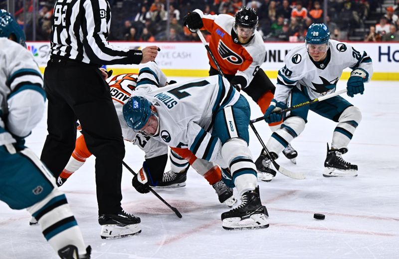 Mar 12, 2024; Philadelphia, Pennsylvania, USA; San Jose Sharks center Nico Sturm (7) wins a faceoff against Philadelphia Flyers center Scott Laughton (21) in the third period at Wells Fargo Center. Mandatory Credit: Kyle Ross-USA TODAY Sports