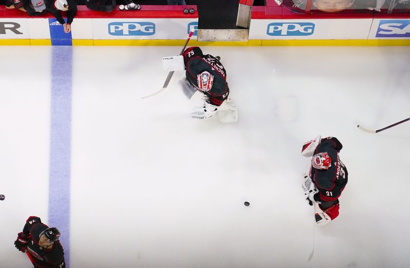 Apr 20, 2024; Raleigh, North Carolina, USA; Carolina Hurricanes goaltender Frederik Andersen (31) and goaltender Pyotr Kochetkov (52) skate before the game against the New York Islanders in game one of the first round of the 2024 Stanley Cup Playoffs at PNC Arena. Mandatory Credit: James Guillory-USA TODAY Sports