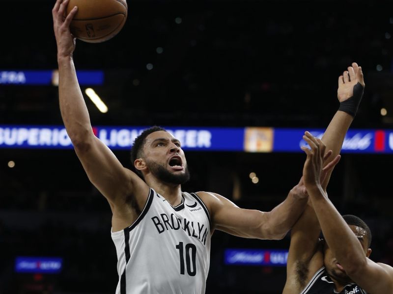 SAN ANTONIO, TX - JANUARY 17: Ben Simmons #10 of the Brooklyn Nets shots over Keldon Johnson #3 of the San Antonio Spurs  in the first half at AT&T Center on January 17, 2023 in San Antonio, Texas. NOTE TO USER: User expressly acknowledges and agrees that, by downloading and or using this photograph, User is consenting to terms and conditions of the Getty Images License Agreement. (Photo by Ronald Cortes/Getty Images)