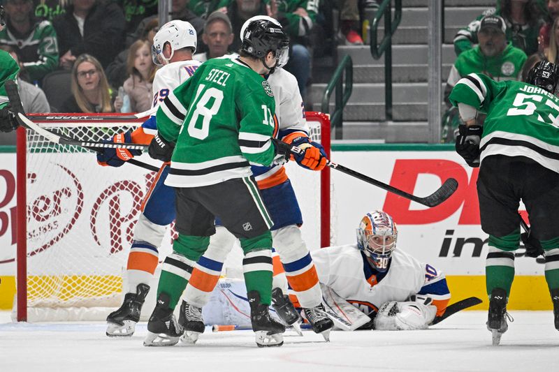 Feb 26, 2024; Dallas, Texas, USA; New York Islanders goaltender Ilya Sorokin (30) covers up a puck in front of Dallas Stars center Wyatt Johnston (53) and center Sam Steel (18) during the third period at the American Airlines Center. Mandatory Credit: Jerome Miron-USA TODAY Sports