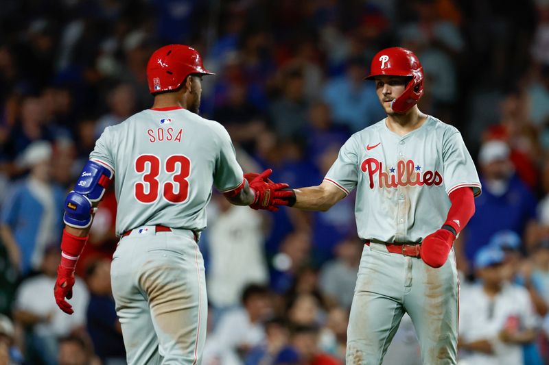 Jul 3, 2024; Chicago, Illinois, USA; Philadelphia Phillies shortstop Trea Turner (7) celebrates with shortstop Edmundo Sosa (33) after scoring against the Chicago Cubs during the eight inning at Wrigley Field. Mandatory Credit: Kamil Krzaczynski-USA TODAY Sports