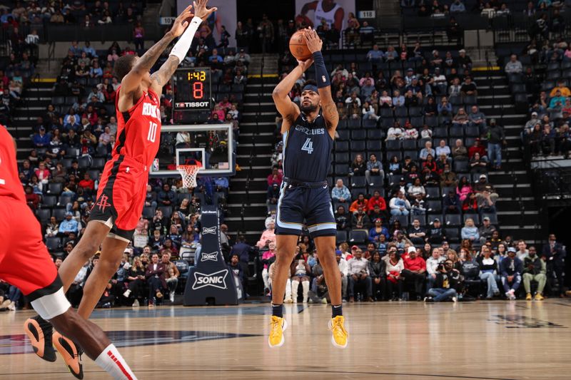 MEMPHIS, TN - FEBRUARY 14: Jordan Goodwin #4 of the Memphis Grizzlies shoots a three point basket against the Houston Rockets on February 14, 2024 at FedExForum in Memphis, Tennessee. NOTE TO USER: User expressly acknowledges and agrees that, by downloading and or using this photograph, User is consenting to the terms and conditions of the Getty Images License Agreement. Mandatory Copyright Notice: Copyright 2024 NBAE (Photo by Joe Murphy/NBAE via Getty Images)