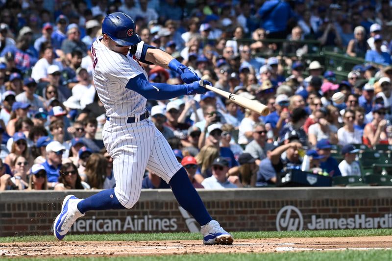 Aug 20, 2023; Chicago, Illinois, USA;  Chicago Cubs second baseman Nico Hoerner (2) singles against the Kansas City Royals during the first inning at Wrigley Field. Mandatory Credit: Matt Marton-USA TODAY Sports