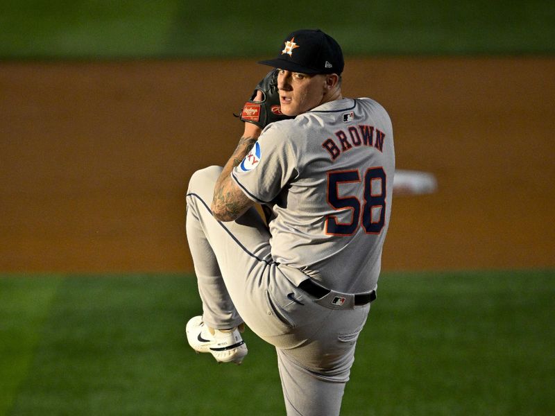 Aug 5, 2024; Arlington, Texas, USA; Houston Astros starting pitcher Hunter Brown (58) pitches against the Texas Rangers during the first inning at Globe Life Field. Mandatory Credit: Jerome Miron-USA TODAY Sports