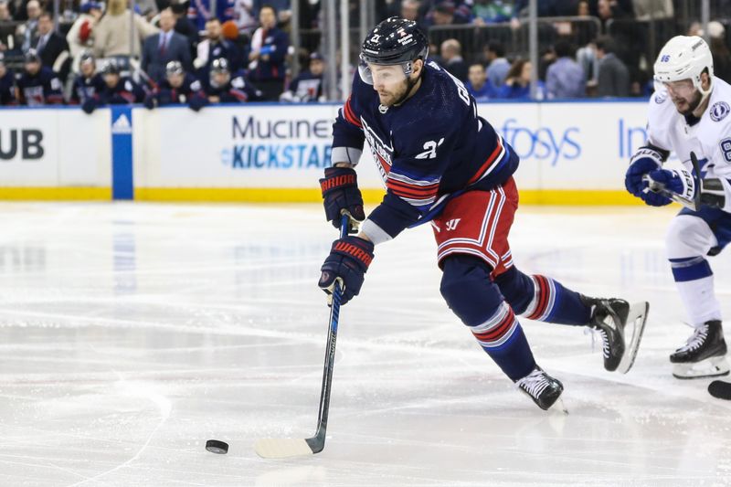 Feb 7, 2024; New York, New York, USA; New York Rangers center Barclay Goodrow (21) controls the puck in the third period against the Tampa Bay Lightning at Madison Square Garden. Mandatory Credit: Wendell Cruz-USA TODAY Sports