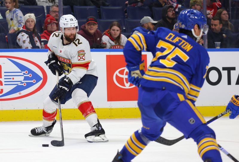 Feb 15, 2024; Buffalo, New York, USA;  Florida Panthers left wing Jonah Gadjovich (12) looks to make a pass during the third period against the Buffalo Sabres at KeyBank Center. Mandatory Credit: Timothy T. Ludwig-USA TODAY Sports