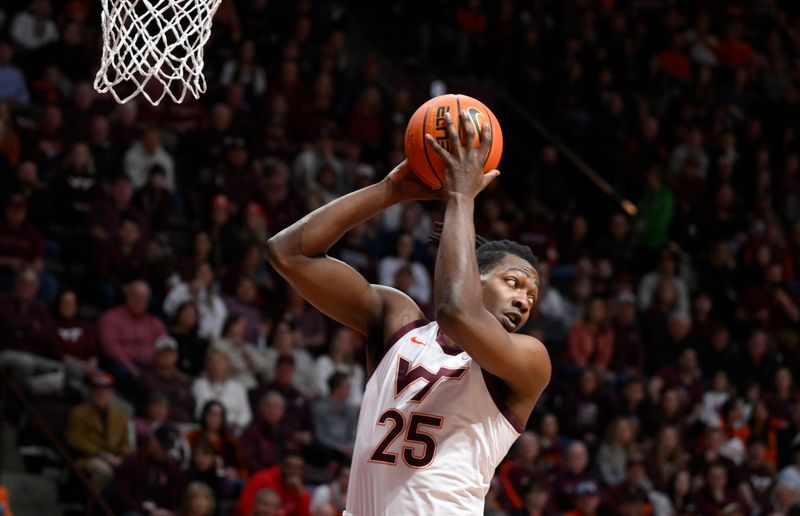 Jan 28, 2023; Blacksburg, Virginia, USA; Virginia Tech Hokies forward Justyn Mutts (25) pulls down a first half rebound against the Syracuse Orange at Cassell Coliseum. Mandatory Credit: Lee Luther Jr.-USA TODAY Sports