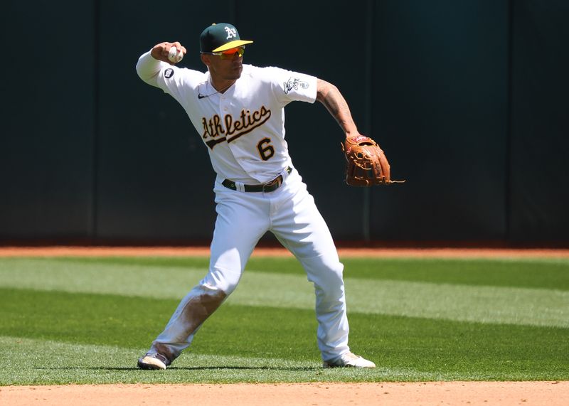 May 31, 2023; Oakland, California, USA; Oakland Athletics second baseman Jace Peterson (6) throws the ball to first base against the Atlanta Braves during the sixth inning at Oakland-Alameda County Coliseum. Mandatory Credit: Kelley L Cox-USA TODAY Sports