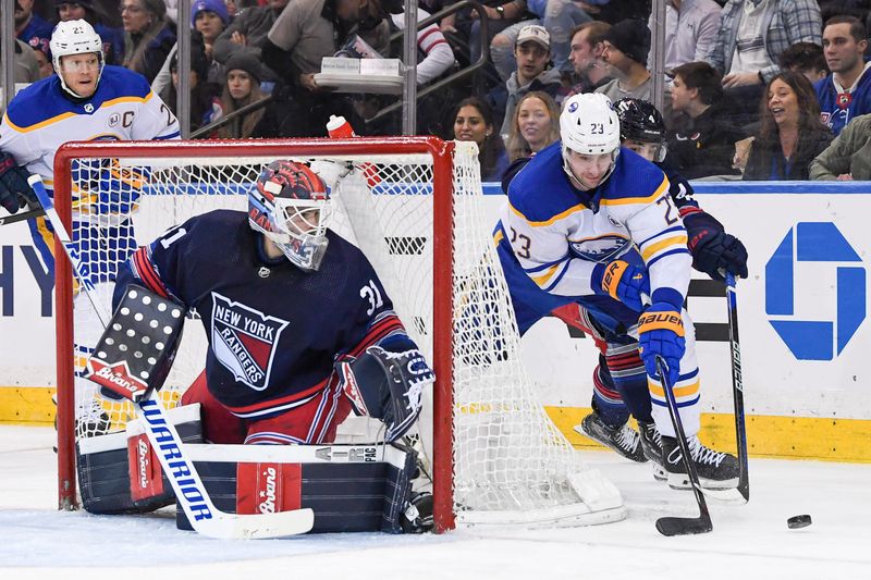 Dec 23, 2023; New York, New York, USA; Buffalo Sabres defenseman Mattias Samuelsson (23) attempted a wrap a round on New York Rangers goaltender Igor Shesterkin (31) during the second period at Madison Square Garden. Mandatory Credit: Dennis Schneidler-USA TODAY Sports