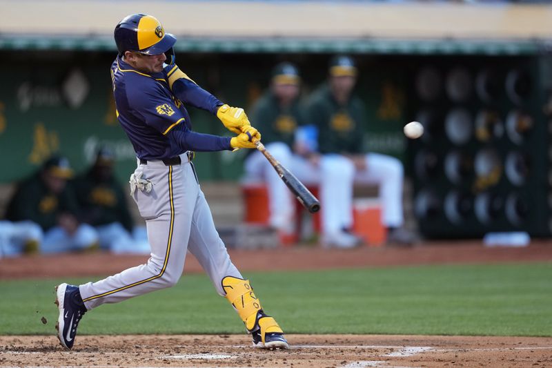 Aug 23, 2024; Oakland, California, USA; Milwaukee Brewers third baseman Joey Ortiz (3) hits a home run against the Oakland Athletics during the second inning at Oakland-Alameda County Coliseum. Mandatory Credit: Darren Yamashita-USA TODAY Sports