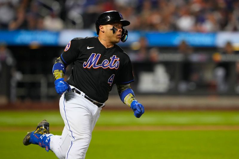 May 21, 2023; New York City, New York, USA; New York Mets catcher Francisco Alvarez (4) runs out a single against the Cleveland Guardians during the eighth inning at Citi Field. Mandatory Credit: Gregory Fisher-USA TODAY Sports