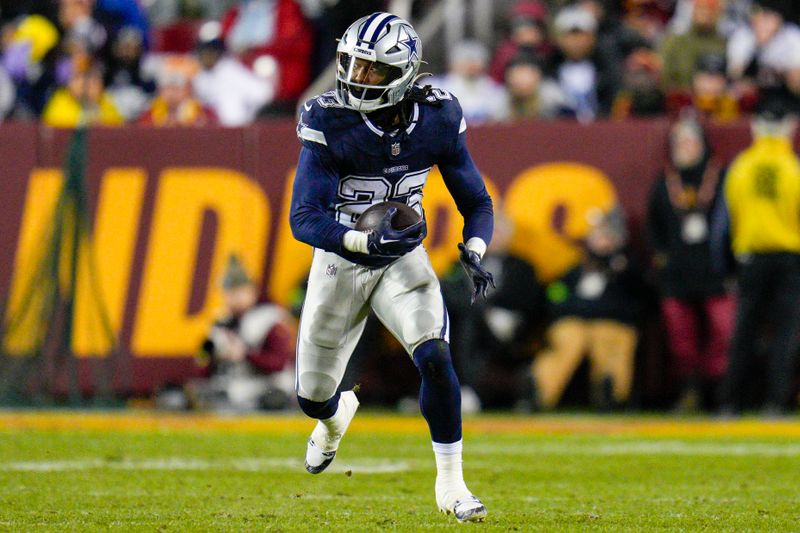 Dallas Cowboys running back Rico Dowdle runs with the ball against the Washington Commanders during the first half, Sunday, January 7, 2024, in Landover, Md. Dallas won 38-10. (AP Photo/Jess Rapfogel)