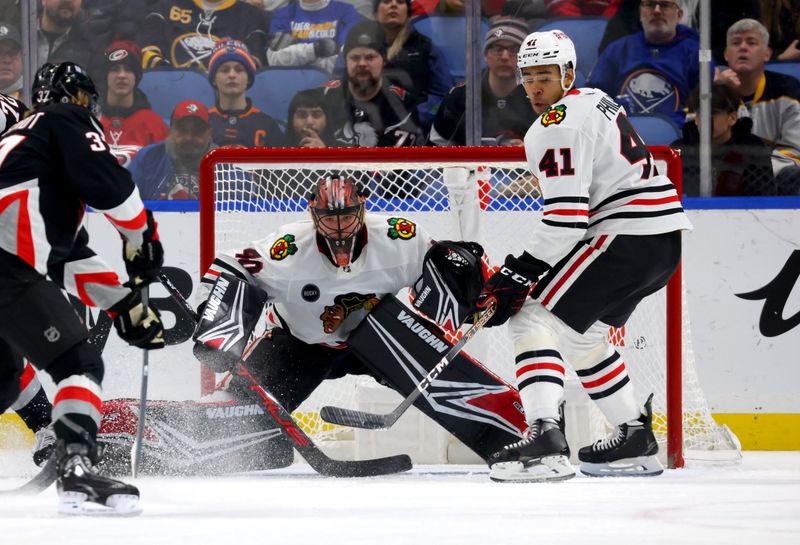 Jan 18, 2024; Buffalo, New York, USA;  Chicago Blackhawks goaltender Arvid Soderblom (40) looks for the puck during the first period against the Buffalo Sabres at KeyBank Center. Mandatory Credit: Timothy T. Ludwig-USA TODAY Sports