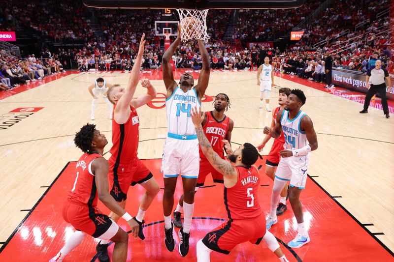 HOUSTON, TEXAS - OCTOBER 23: Moussa Diabate #14 of the Charlotte Hornets goes up against Fred VanVleet #5 of the Houston Rockets during the second half at Toyota Center on October 23, 2024 in Houston, Texas.  NOTE TO USER: User expressly acknowledges and agrees that, by downloading and or using this photograph, User is consenting to the terms and conditions of the Getty Images License Agreement. (Photo by Alex Slitz/Getty Images)