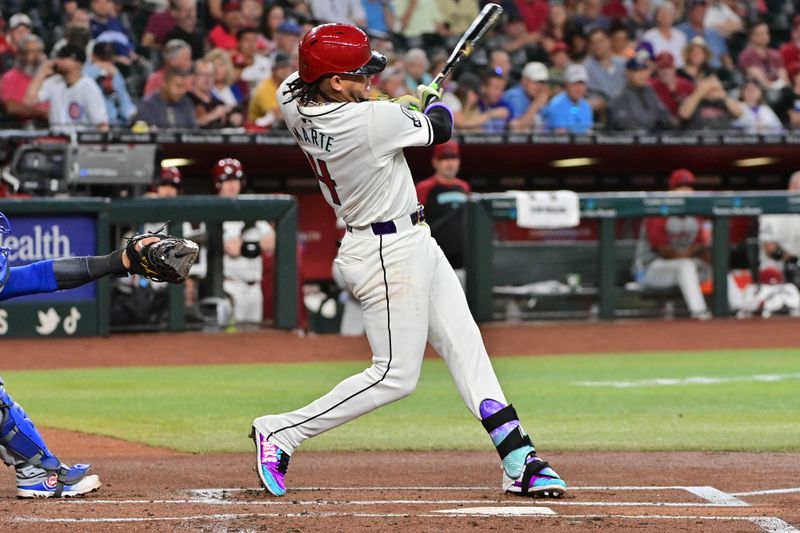 Apr 17, 2024; Phoenix, Arizona, USA;  Arizona Diamondbacks second baseman Ketel Marte (4) hits a solo home run on the first pitch in the bottom on the first inning against the Chicago Cubs at Chase Field. Mandatory Credit: Matt Kartozian-USA TODAY Sports