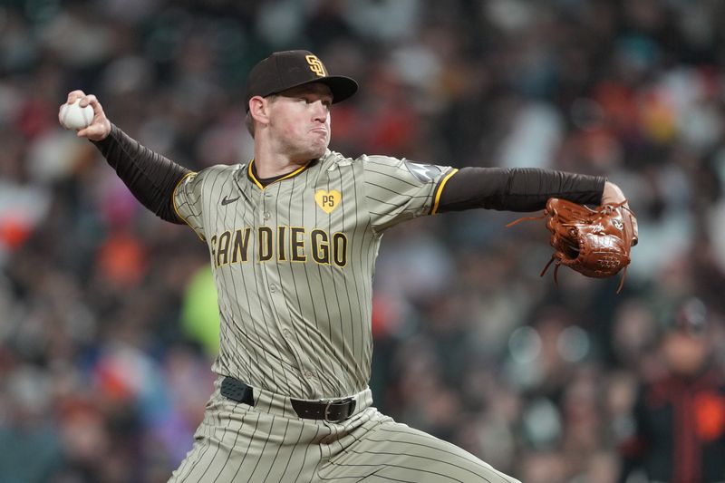 Apr 6, 2024; San Francisco, California, USA; San Diego Padres pitcher Stephen Kolek (32) throws a pitch against the San Francisco Giants during the eighth inning at Oracle Park. Mandatory Credit: Darren Yamashita-USA TODAY Sports