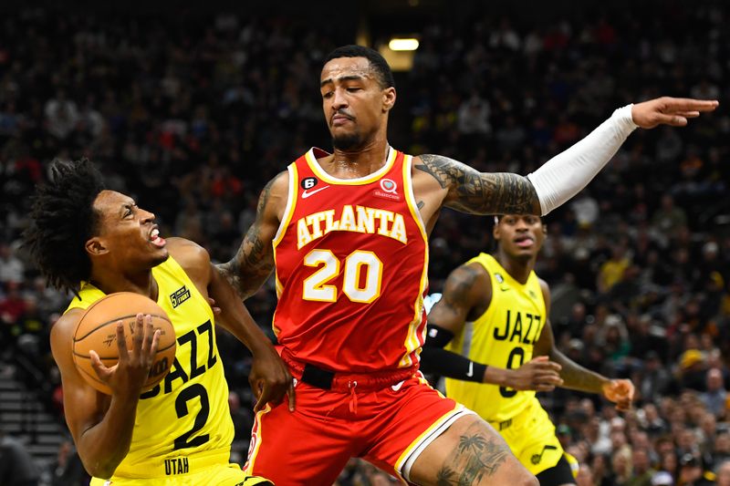 SALT LAKE CITY, UTAH - FEBRUARY 03: John Collins #20 of the Atlanta Hawks defends Collin Sexton #2 of the Utah Jazz during the first half of a game at Vivint Arena on February 03, 2023 in Salt Lake City, Utah.  NOTE TO USER: User expressly acknowledges and agrees that, by downloading and or using this photograph, User is consenting to the terms and conditions of the Getty Images License Agreement. (Photo by Alex Goodlett/Getty Images)