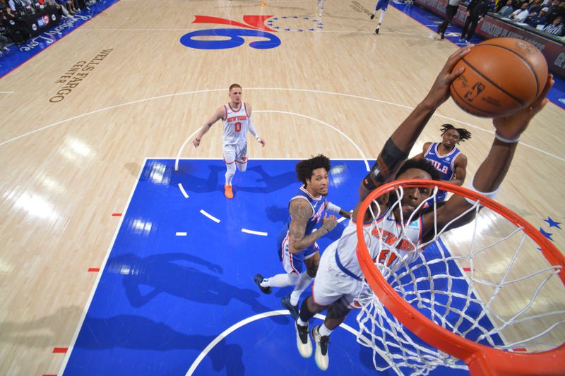 PHILADELPHIA, PA - APRIL 25: OG Anunoby #8 of the New York Knicks dunks the ball during the game against the Philadelphia 76ers during Round 1 Game 3 of the 2024 NBA Playoffs on April 25, 2024 at the Wells Fargo Center in Philadelphia, Pennsylvania NOTE TO USER: User expressly acknowledges and agrees that, by downloading and/or using this Photograph, user is consenting to the terms and conditions of the Getty Images License Agreement. Mandatory Copyright Notice: Copyright 2024 NBAE (Photo by Jesse D. Garrabrant/NBAE via Getty Images)