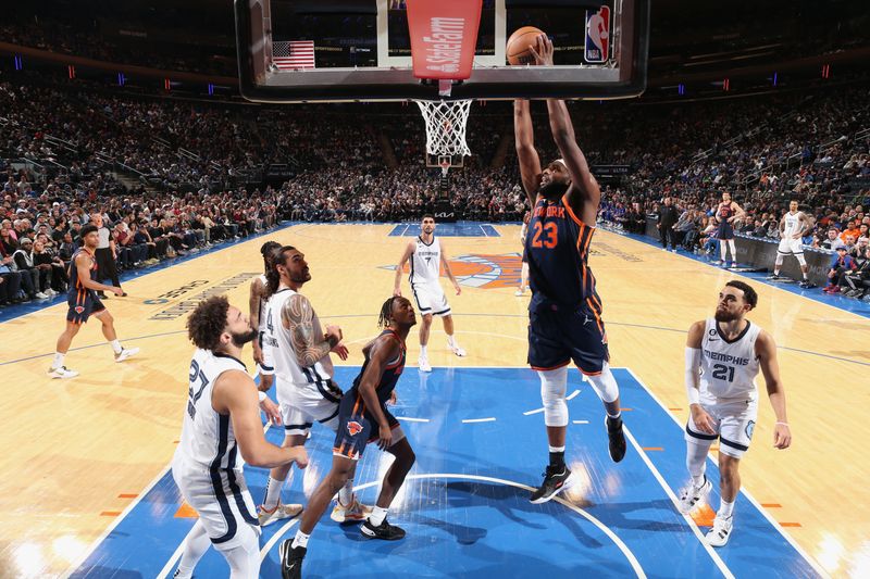 NEW YORK, NY - NOVEMBER 27: Mitchell Robinson #23 of the New York Knicks dunks the ball during the game against the Memphis Grizzlies on November 27, 2022 at Madison Square Garden in New York City, New York.  NOTE TO USER: User expressly acknowledges and agrees that, by downloading and or using this photograph, User is consenting to the terms and conditions of the Getty Images License Agreement. Mandatory Copyright Notice: Copyright 2022 NBAE  (Photo by Nathaniel S. Butler/NBAE via Getty Images)