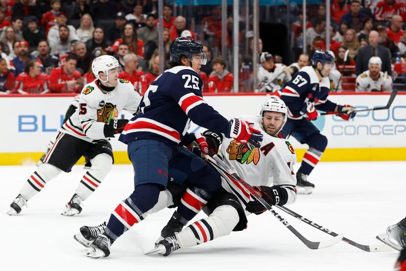 Mar 9, 2024; Washington, District of Columbia, USA; Washington Capitals defenseman Ethan Bear (25) checks Chicago Blackhawks center Jason Dickinson (16) in the second period at Capital One Arena. Mandatory Credit: Geoff Burke-USA TODAY Sports