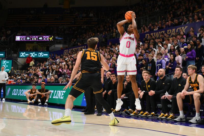Feb 4, 2026; Seattle, Washington, USA; Washington Huskies guard Quimari Peterson (0) shoots the ball over Iowa Hawkeyes guard Brendan Hausen (15) during the first half at Alaska Airlines Arena at Hec Edmundson Pavilion. Mandatory Credit: Steven Bisig-Imagn Images
