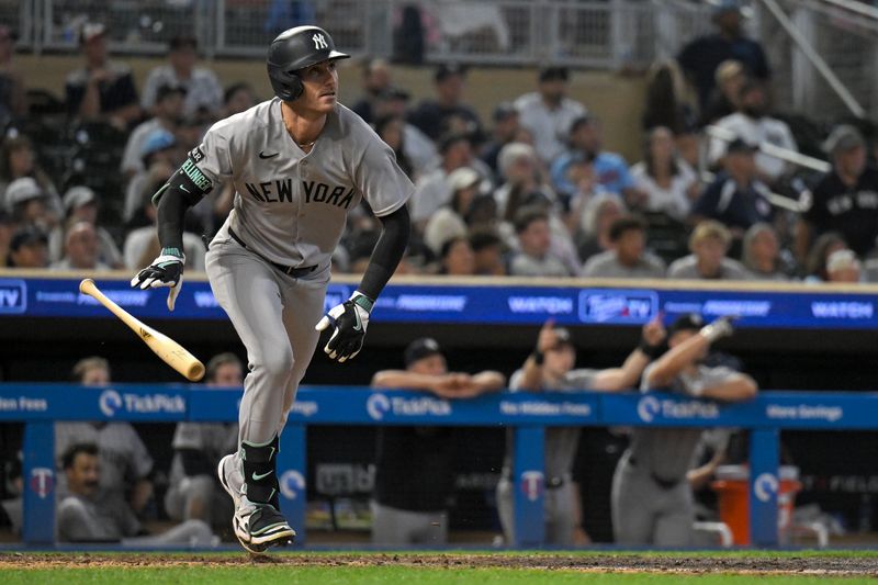 Sep 17, 2025; Minneapolis, Minnesota, USA;  New York Yankees outfielder Cody Bellinger (35) hits a two-run home run against the Minnesota Twins during the ninth inning at Target Field. Mandatory Credit: Nick Wosika-Imagn Images