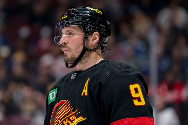 Feb 13, 2023; Vancouver, British Columbia, CAN; Vancouver Canucks forward J.T. Miller (9) during a stop in play against the Detroit Red Wings in the second period at Rogers Arena. Mandatory Credit: Bob Frid-USA TODAY Sports