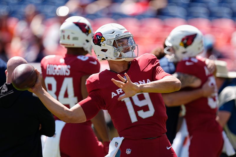 Arizona Cardinals quarterback Desmond Ridder warms up prior to a preseason NFL football game against the Denver Broncos, Sunday, Aug. 25, 2024, in Denver. (AP Photo/David Zalubowski)