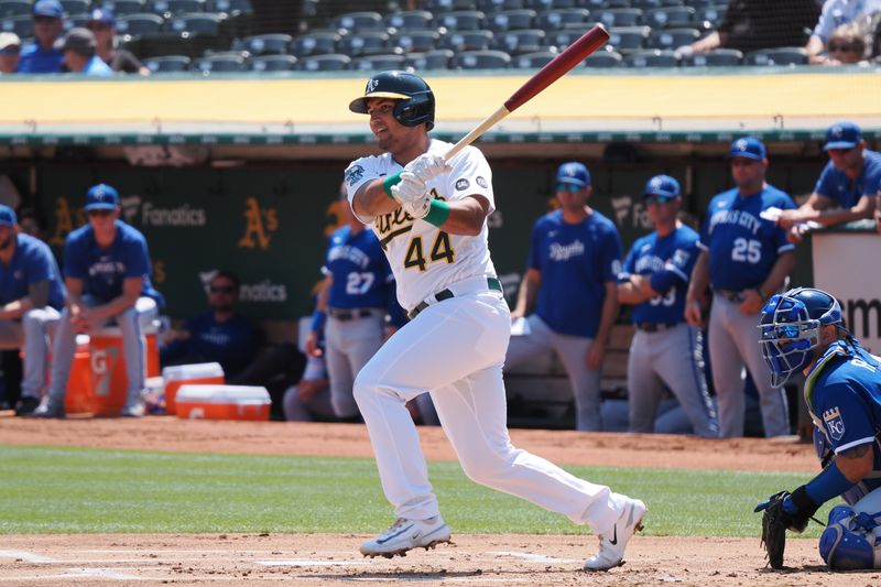 Aug 23, 2023; Oakland, California, USA; Oakland Athletics first baseman Carlos Perez (44) follows through as he hits a ground ball into a fielder   s choice during the first inning against the Kansas City Royals at Oakland-Alameda County Coliseum. Mandatory Credit: Kelley L Cox-USA TODAY Sports